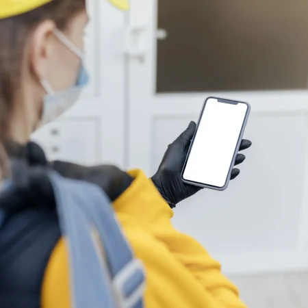 close-up-delivery-woman-holding-phone